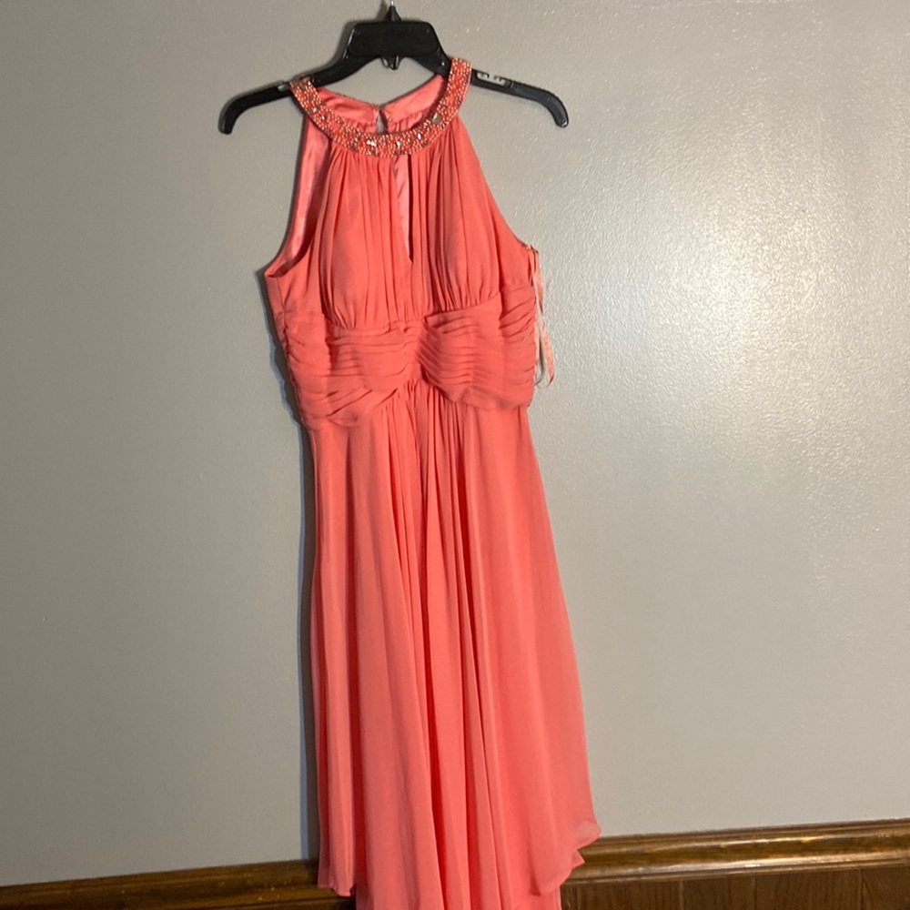 Sleeveless dress, light pink/orange color, beading around coat